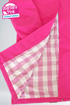 Close-up of a pink jacket showing its open flap and interior checkered lining in white and light pink. A label reads "BARBARA PINK WINDBREAKER by looselyboho" in the top left corner, highlighting it as a unique piece made from lightweight water-resistant fabric.